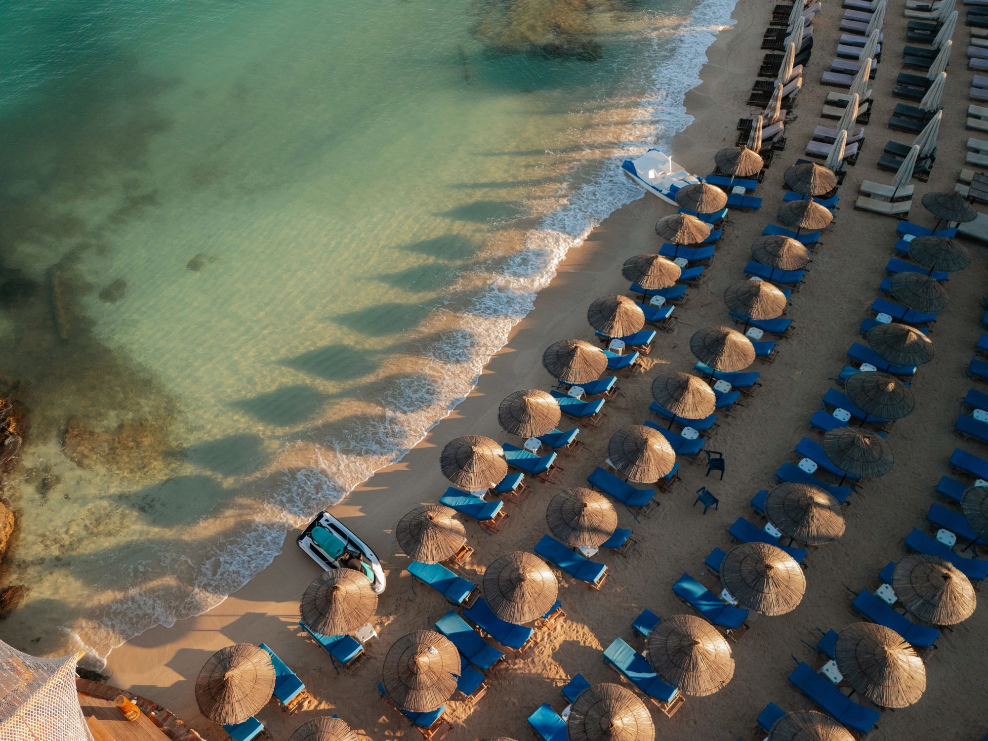 Turquoise water and beach umbrellas on the Albanian coast